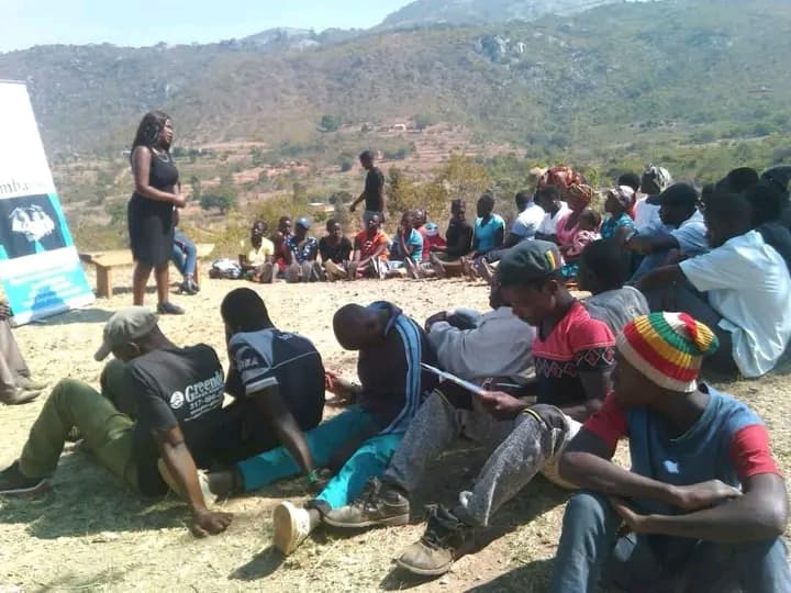 Outdoor youth dialogue on a Manicaland hillside